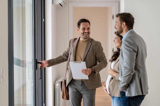 Agent showing home to pregnant couple